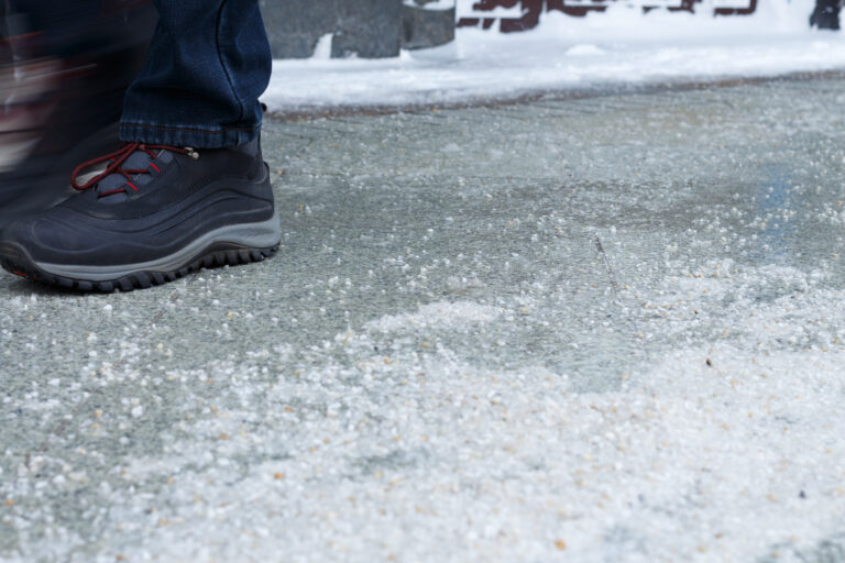 A woman is stood on an icy terrain
