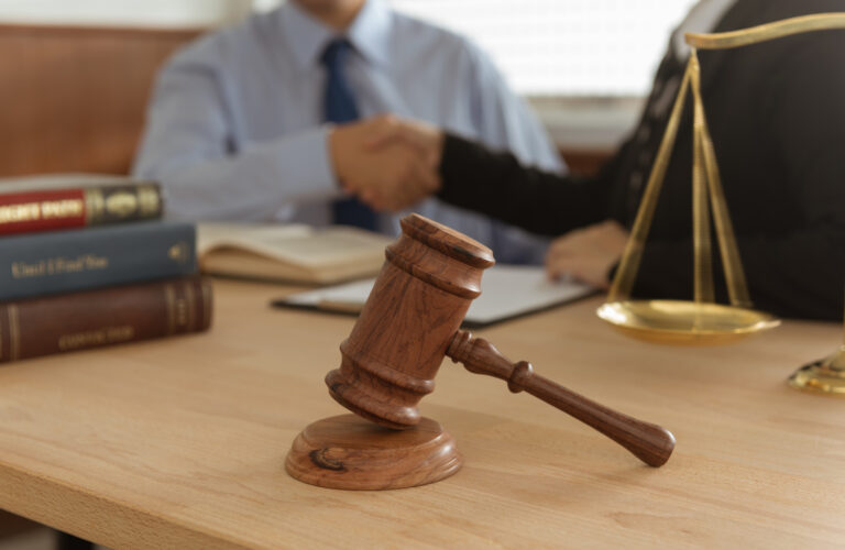 A solicitor and their client discussing NHS data breach compensation