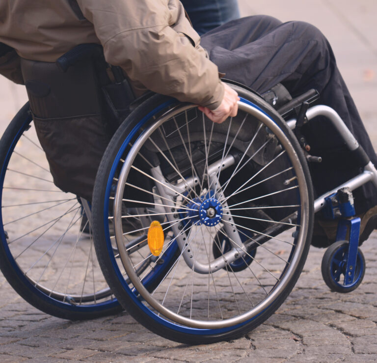 A man using a wheelchair outside