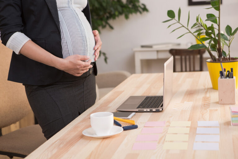 A woman researches how to make a retained placenta compensation claim