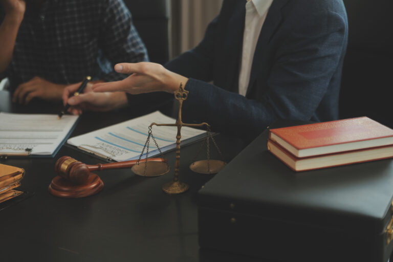 A solicitor discusses a Conditional Fee Agreement with their client.