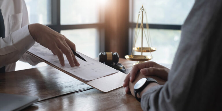 A solicitor explaining the diabetes compensation claims process to a client