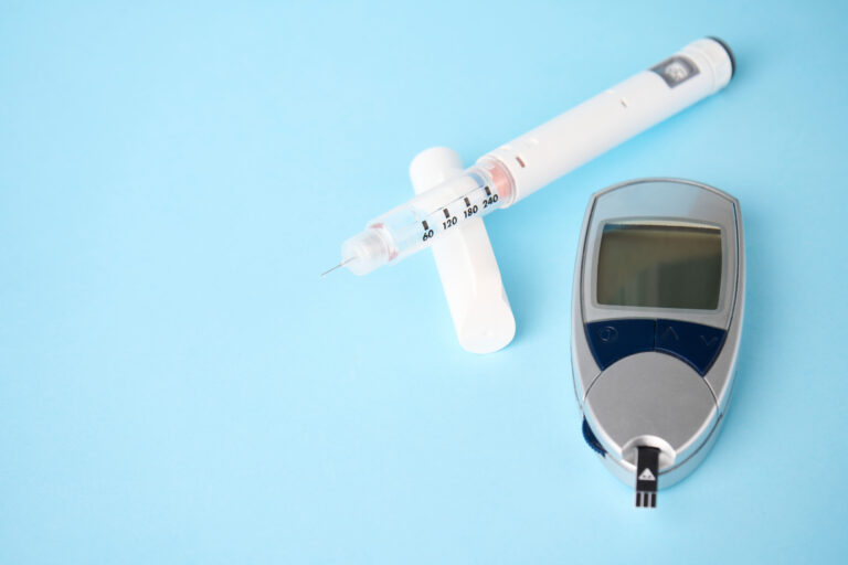 A glucometer and insulin injection