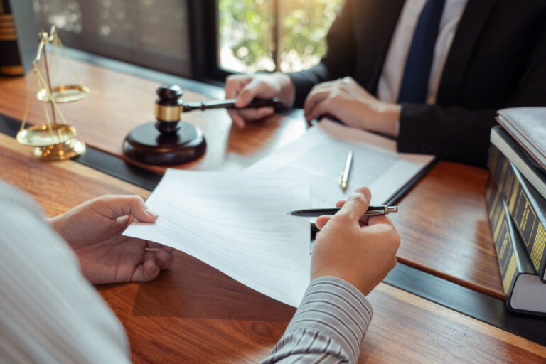 A specialist personal injury solicitor discusses a claim with their client