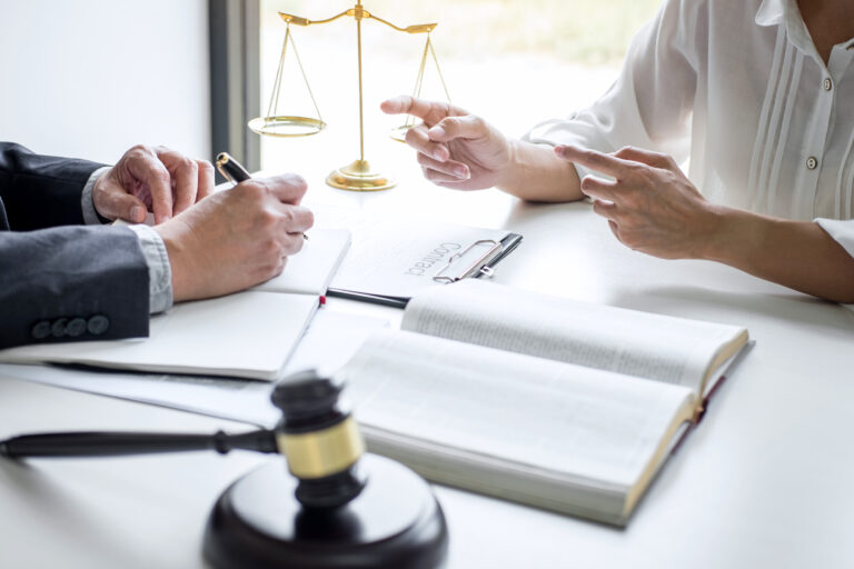 A solicitor and a client discussing accident and emergency claims and generic medical negligence claims.