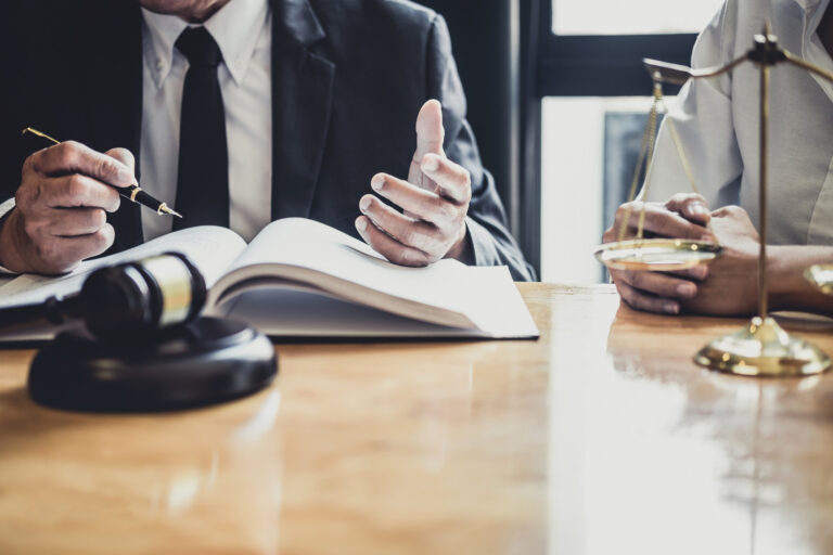 Specialist solicitor discusses a claim with their client